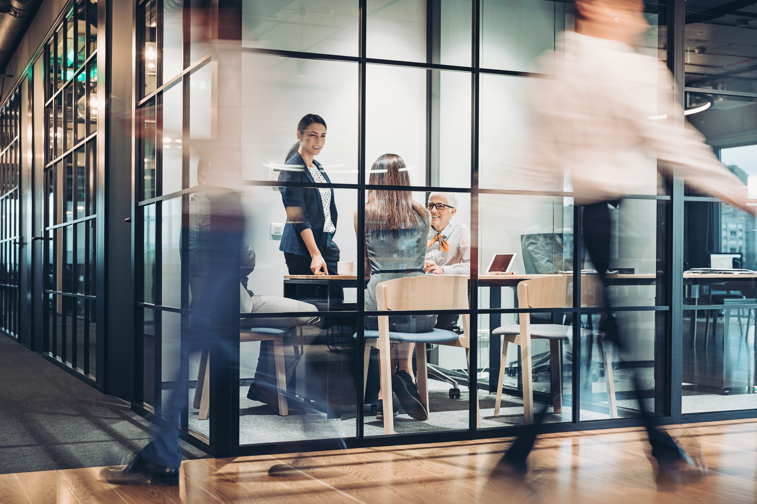 Business persons walking and working around the office building